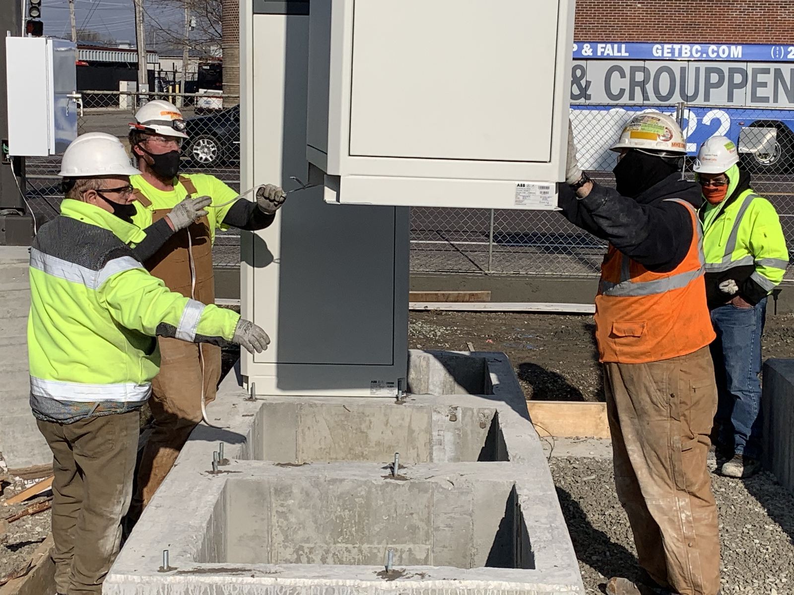 A Local 1 electrician cutting concrete on a jobsite